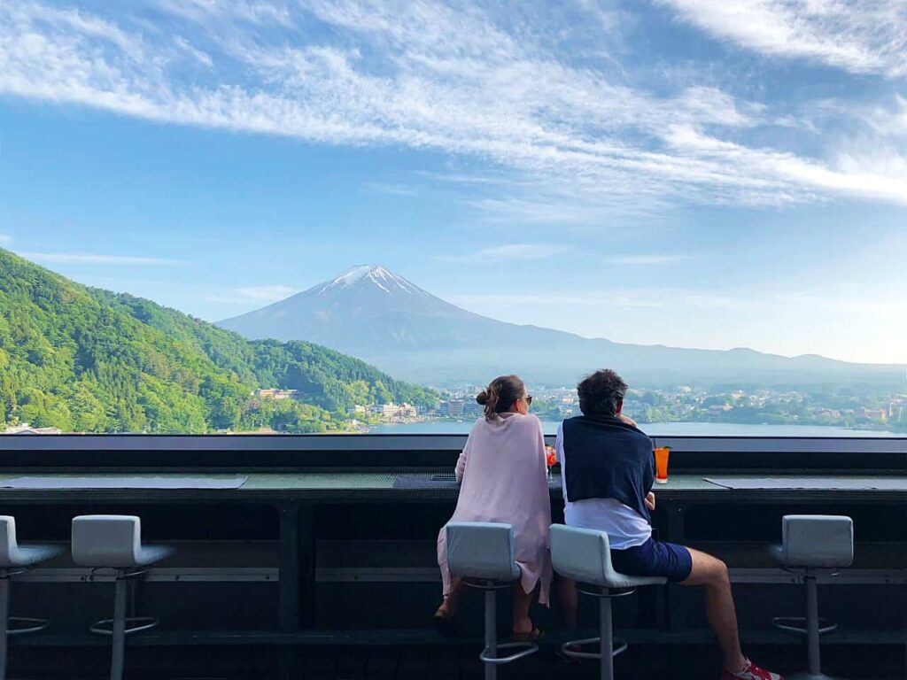 Couple enjoying views of Mount Fuji from outdoor rooftop at Mizno hotel