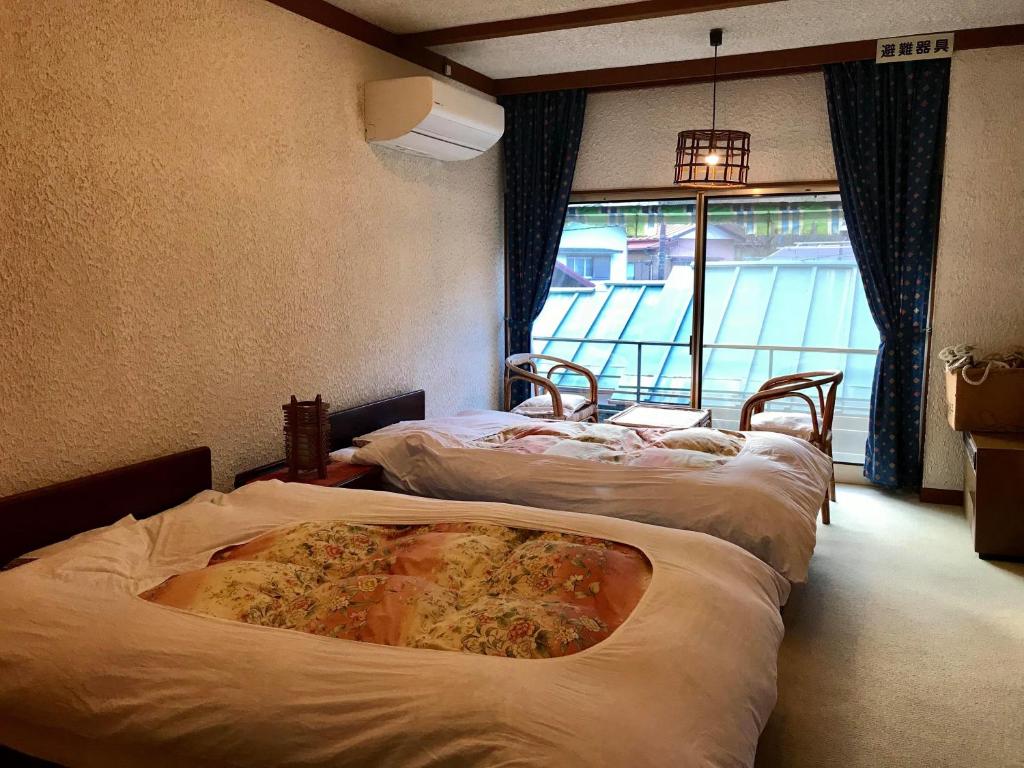 Tsukinoya traditional style japanese room with futons