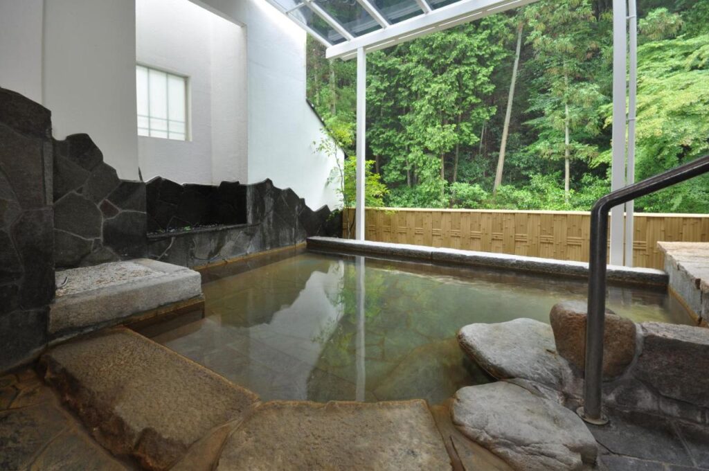 Okumizuma Onsen outdoor bath with forest view