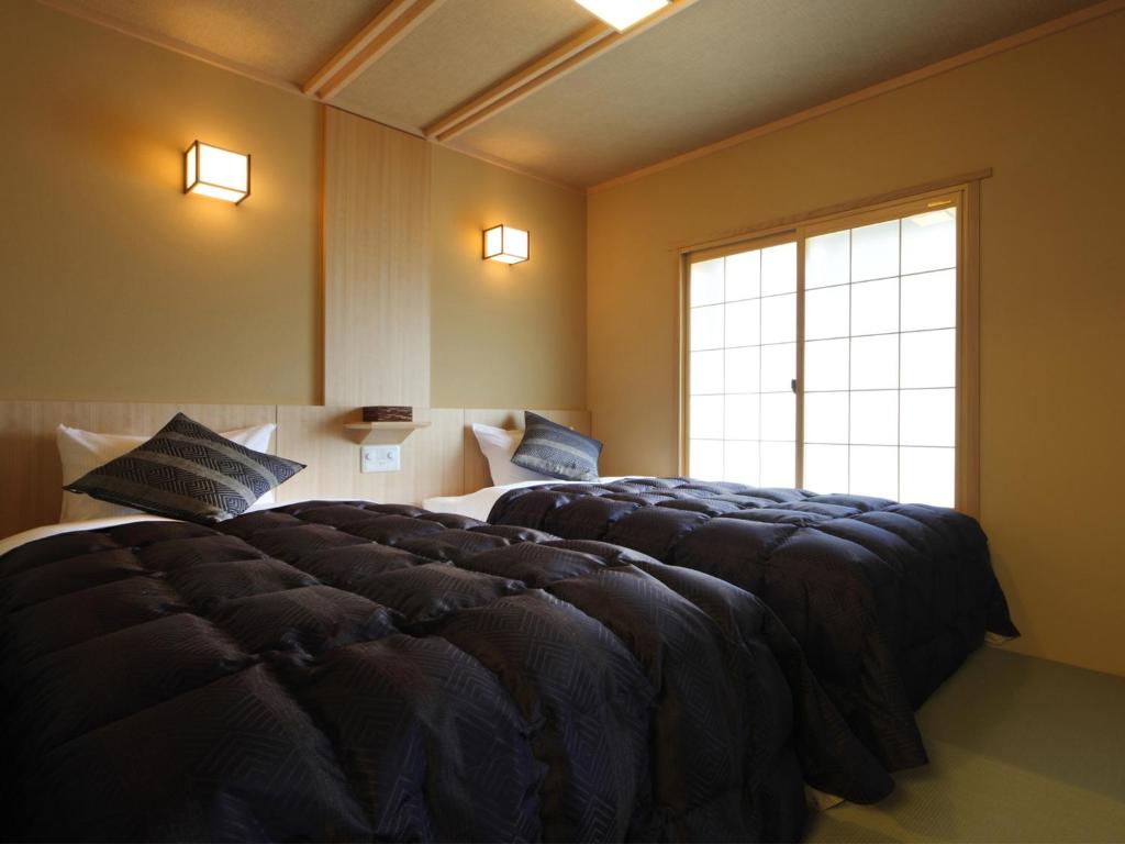 Asaya Hotel Traditional Room Beds