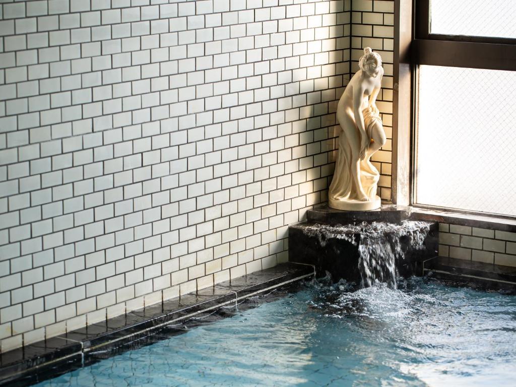 Kaneyoshi Ryokan Onsen Waterfall Statue
