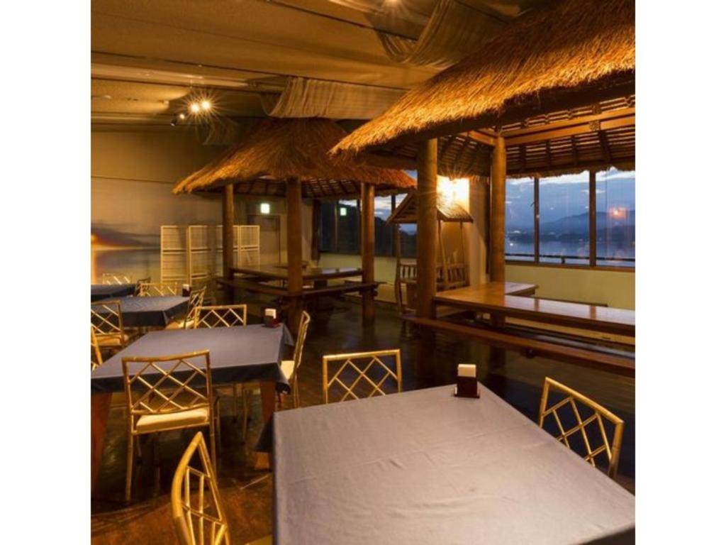 Hazu Dining Area With Thatch Roofs