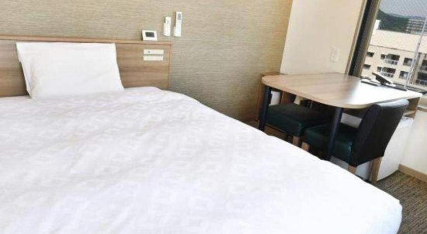 Hotel Kawaroku Her Stage Takamatsu Room With Bed And Table
