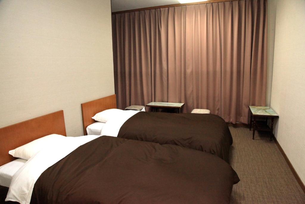 Hotel New Kotobuki Bedroom With Two Beds