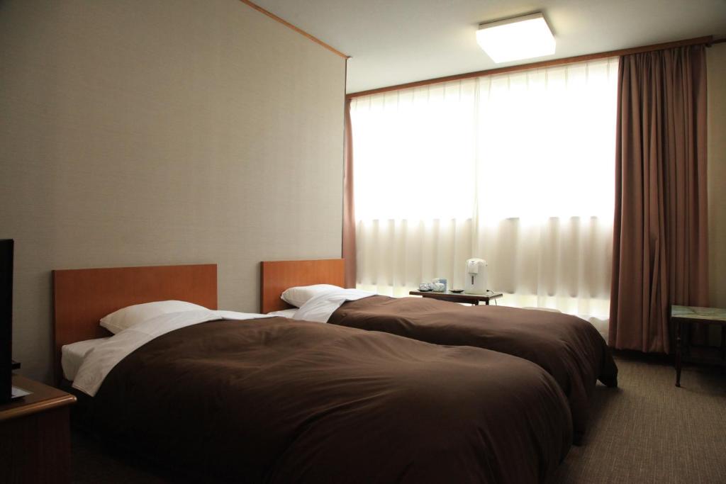 Hotel New Kotobuki Twin Bed Room