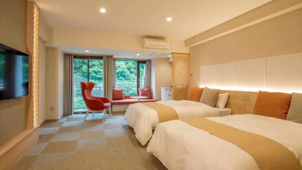 Kinugawa Modern Room With Twin Beds And Red Chair