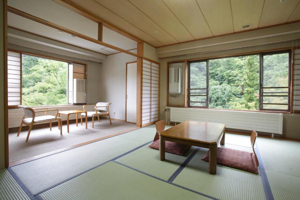 Saito Hotel Tatami Room And Seating Area