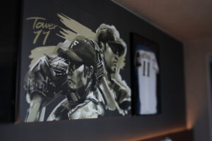 Baseball-themed wall art and framed jersey