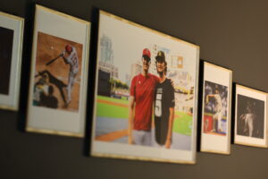 Framed baseball photos hanging on a wall