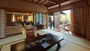 Tatami room with low table and chairs by balcony