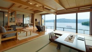Tatami seating area and table by large lakeview windows