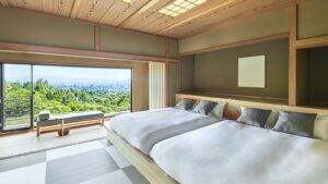 Twin beds in tatami room with large window view
