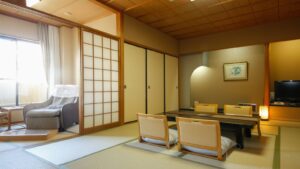 Tatami room with low table, floor chairs, and armchair