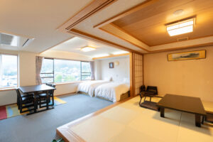 Tatami room with low table and two beds