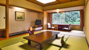 Tatami room with low table and chairs by window