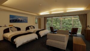 Twin beds in a guest room with window seating