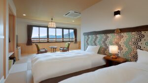 Twin beds in a guest room with window seating