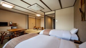 Twin beds in a tatami guest room
