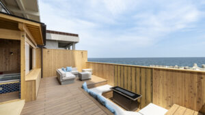 Deck seating area with ocean view and outdoor bath