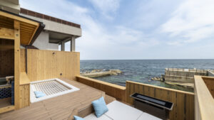 Private open-air bath on terrace overlooking the sea