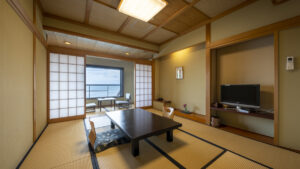 Tatami room with low table and chairs by window