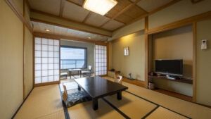 Tatami room with low table and chairs by window