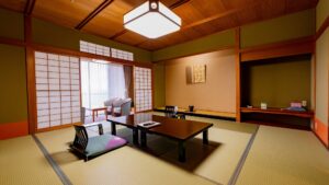 Camera in tatami con tavolo basso e sedie da pavimento