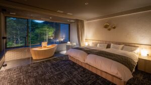 Twin beds beside a private bath and window