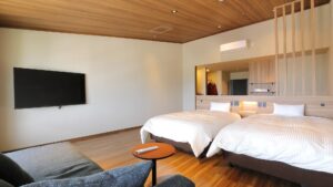 Twin beds in a modern ryokan guest room