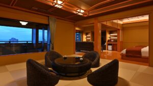 Tatami guest room with round table and lounge chairs