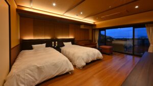 Twin beds in a guest room with window view