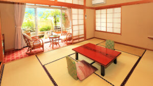 Habitación de tatami con mesa baja y sillas junto a la ventana
