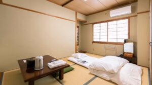 Japanese-style room with futons on tatami floor