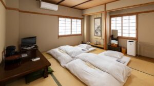 Tatami room with laid-out futons and low table