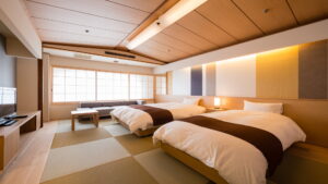 Japanese-style room with two beds and tatami flooring
