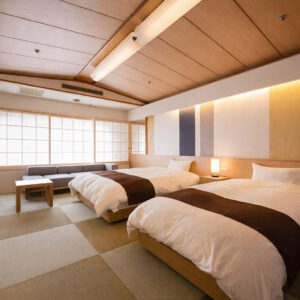 Twin beds in a tatami guest room