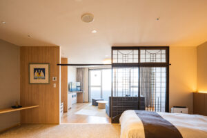 Modern guest room with bed and sitting area