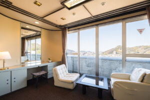 Seating area with chairs and window in guest room