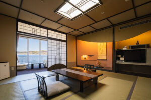 Tatami room with low table and chairs by window