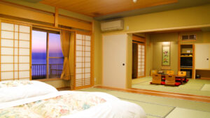 Futons in a tatami room with low table seating