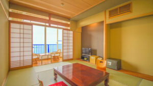 Tatami room with low table and balcony chairs