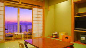 Tatami room with low table and balcony chairs