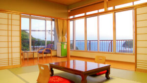 Tatami room with low table and ocean-view windows