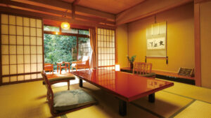 Tatami room with low table and chairs by window
