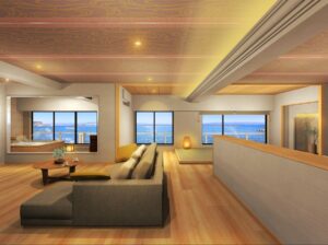 Espace de vie avec canapé, table basse et fenêtres avec vue sur l’océan