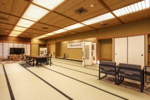 Spacious tatami room with table and chairs