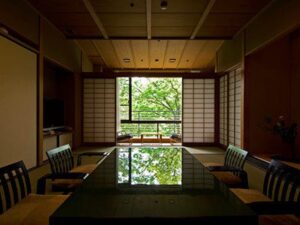 Tatami room with low table and chairs by window