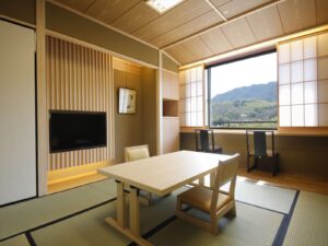 Tatami room with low table and chairs by window