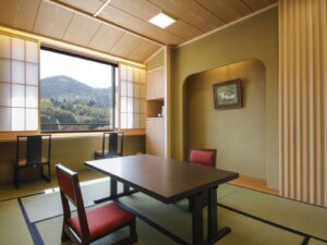 Tatami room with low table and mountain view