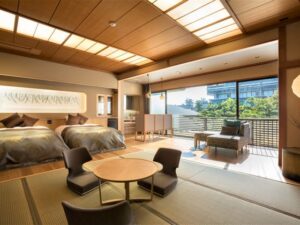 Tatami guest room with twin beds and seating